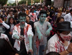 People dressed as zombies take part in an annual parade in Queretaro, north of Mexico City, July 30, 2011. Hundreds of people took part in the event on Saturday, now in its third year in Queretaro, to pay homage to the character typically depicted as the mindless walking dead with a penchant for human flesh and brains, made popular in movies, books and comics. REUTERS/Demian Chavez Hernandez (MEXICO - Tags: SOCIETY ODDLY)