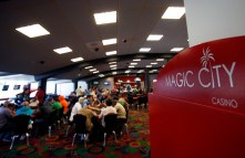 FILE - In this Nov. 9, 2011 file photo, patrons play poker at the Magic City Casino in Miami. As Florida lawmakers appear ready to allow key portions of the states high-stakes gambling deal with the Seminole to expire, other gambling interests are watching keenly for openings in the multi-billion dollar industry if the tribe and Gov. Rick Scott cant negotiate something new. (AP Photo/Wilfredo Lee, File)